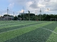 Le football artificiel vert de Cesped engazonnent la taille de 40mm renforcée fournisseur
