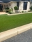 Le faux plancher vert extérieur d'herbe tapissent le gazon artificiel synthétique pour le jardin fournisseur